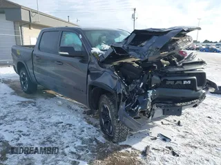 2022 Ram 1500 Rebel z VIN 1C6SRFLT9NN204868, wystawiony jako IAAI lot #41351273 z przebiegiem 67 120 mil mil oraz . Historia ofert i sprzedaży dostępna na DreamBid. Obrazek 1.
