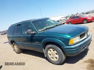 1996 Oldsmobile Bravada z VIN 1GHDT13W5T2711291, wystawiony jako IAAI lot #42502672 z przebiegiem 219 062 mil mil oraz . Historia ofert i sprzedaży dostępna na DreamBid. Obrazek 12.