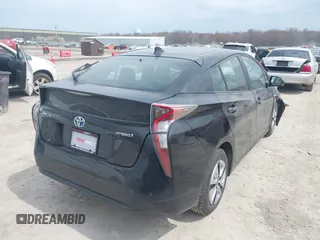 2017 Toyota Prius Two with VIN JTDKARFUXH3041931, listed as a IAAI auction lot 42075004 with 75,768 mi miles and . Bid and sale history available at DreamBid. Image 4.