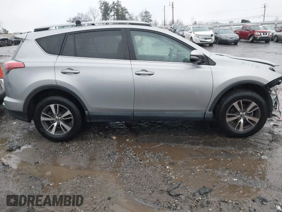 2018 Toyota RAV4 XLE with VIN 2T3RFREV2JW717351, listed as a IAAI auction lot 41576522 with 147,116 mi miles. Bid and sale history available at carsss.com. Image 13.