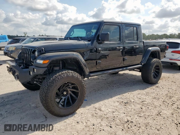2021 Jeep Gladiator Freedom with VIN 1C6HJTAG8ML580882, listed as a Copart auction lot 57690885 with Not provided miles and Salvage title. Bid and sale history available at DreamBid. Image 1.