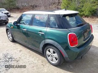 2016 MINI Hardtop 4 Door with VIN WMWXU1C57G2D09401, listed as a IAAI auction lot 42013695 with 43,437 mi miles and . Bid and sale history available at DreamBid. Image 3.