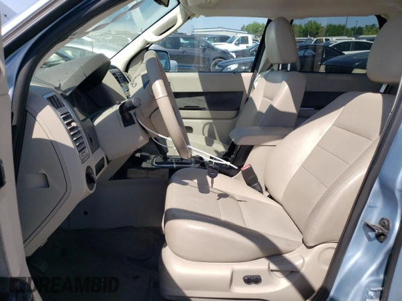 2009 Ford Escape Hybrid z VIN 1FMCU49309KA30344, wystawiony jako Copart lot #55644835 z przebiegiem 112 641 mil mil oraz Szkoda całkowita • Salvage title. Historia ofert i sprzedaży dostępna na DreamBid. Obrazek 7.