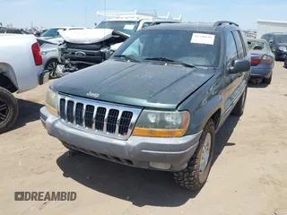 2001 Jeep Grand Cherokee Laredo with VIN 1J4GW48N51C612600, listed as a IAAI auction lot 42348631 with 165,918 mi miles and . Bid and sale history available at DreamBid. Image 6.