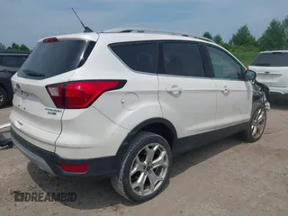 2019 Ford Escape Titanium with VIN 1FMCU9J90KUA86338, listed as a IAAI auction lot 42690159 with 115,891 mi miles and . Bid and sale history available at DreamBid. Image 4.