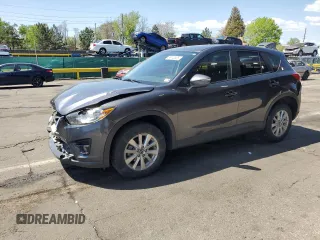 2016 Mazda CX-5 Touring z VIN JM3KE4CY4G0685771, wystawiony jako Copart lot #56140525 z przebiegiem 92 692 mil mil oraz Szkoda całkowita • Salvage title. Historia ofert i sprzedaży dostępna na DreamBid. Obrazek 1.