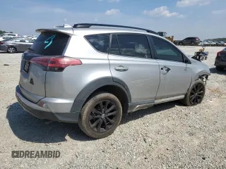 2018 Toyota RAV4 XLE with VIN 2T3WFREVXJW427748, listed as a Copart auction lot 61833055 with 104,057 mi miles and Salvage title. Bid and sale history available at DreamBid. Image 3.