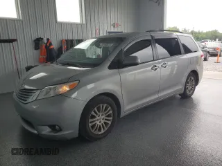2014 Toyota Sienna XLE with VIN 5TDYK3DC3ES472748, listed as a Copart auction lot 61184875 with 137,629 mi miles and Salvage title. Bid and sale history available at DreamBid. Image 1.