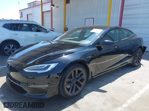 2021 Tesla Model S Long Range z VIN 5YJSA1E54MF429360, wystawiony jako IAAI lot #42662440 z przebiegiem 36 395 mil mil oraz . Historia ofert i sprzedaży dostępna na DreamBid. Obrazek 17.