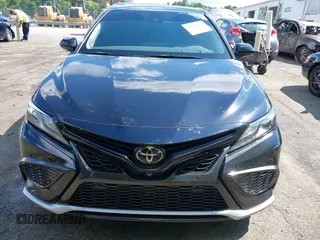 2022 Toyota Camry TRD with VIN 4T1KZ1AK2NU064511, listed as a IAAI auction lot 42176608 with 28,064 mi miles and . Bid and sale history available at DreamBid. Image 12.