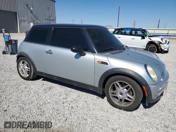 2002 MINI Hardtop with VIN WMWRC33472TC34281, listed as a Copart auction lot 71631644 with 196,947 mi miles and Salvage Title. Bid and sale history available at DreamBid. Image 4.