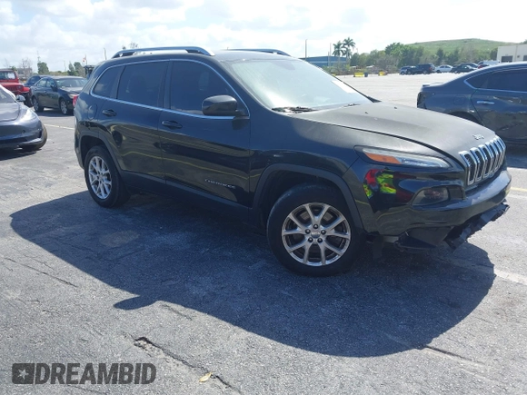 2015 Jeep Cherokee Latitude with VIN 1C4PJLCB4FW683904, listed as a IAAI auction lot 41579059 with 126,156 mi miles and . Bid and sale history available at carsss.com. Image 1.