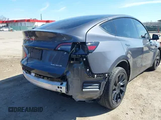 2023 Tesla Model Y Long Range with VIN 7SAYGDEE2PF883687, listed as a IAAI auction lot 41589837 with 36,890 mi miles. Bid and sale history available at carsss.com. Image 22.