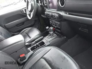 2023 Jeep Wrangler Sahara with VIN 1C4JJXP64PW684210, listed as a IAAI auction lot 42244388 with 23,622 mi miles and . Bid and sale history available at DreamBid. Image 5.