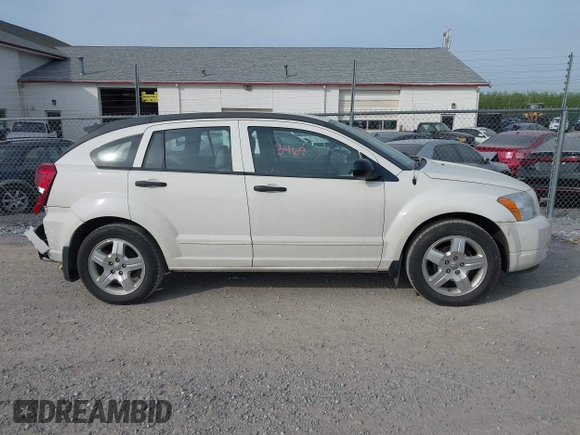 2007 Dodge Caliber SXT with VIN 1B3HB48B57D317870, listed as a IAAI auction lot 42123469 with 170,570 mi miles and . Bid and sale history available at DreamBid. Image 13.