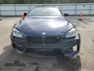 2015 BMW M6 z VIN WBSLZ9C59FD651474, wystawiony jako Copart lot #60882454 z przebiegiem Nie podano mil oraz Szkody całkowita. Historia ofert i sprzedaży dostępna na DreamBid. Obrazek 5.