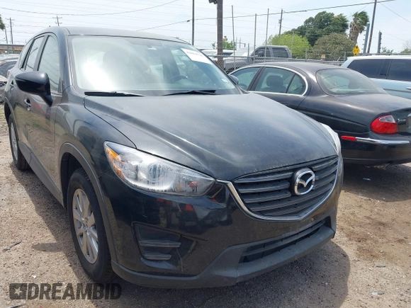 2016 Mazda CX-5 Sport with VIN JM3KE2BY8G0847018, listed as a IAAI auction lot 42064726 with 69,017 mi miles and . Bid and sale history available at DreamBid. Image 1.