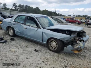 1999 Ford Crown Victoria LX with VIN 2FAFP74WXXX137154, listed as a Copart auction lot 71418784 with 97,589 mi miles and Salvage Title. Bid and sale history available at carsss.com. Image 4.