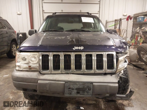 1997 Jeep Grand Cherokee Laredo with VIN 1J4GZ58S8VC675487, listed as a IAAI auction lot 41034046 with 243,284 mi miles. Bid and sale history available at carsss.com. Image 12.