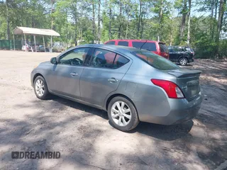 2014 Nissan Versa SV with VIN 3N1CN7AP2EL851670, listed as a IAAI auction lot 42167654 with 112,277 mi miles. Bid and sale history available at carsss.com. Image 3.