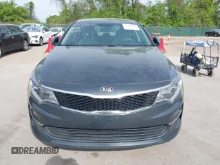 2016 Kia Optima LX with VIN KNAGT4L37G5073752, listed as a IAAI auction lot 42132621 with 136,818 mi miles. Bid and sale history available at carsss.com. Image 6.