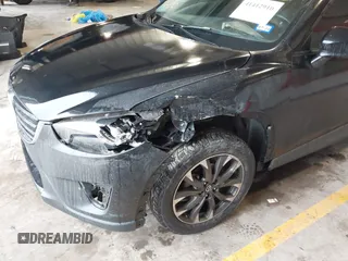 2016 Mazda CX-5 Grand Touring with VIN JM3KE2DY9G0705127, listed as a IAAI auction lot 41412910 with 181,993 mi miles. Bid and sale history available at carsss.com. Image 6.