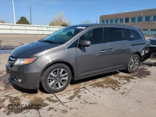 2014 Honda Odyssey Touring with VIN 5FNRL5H95EB052523, listed as a Copart auction lot 52214055 with 131,350 mi miles and Salvage Title. Bid and sale history available at DreamBid. Image 1.