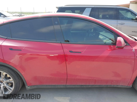 2023 Tesla Model Y Long Range z VIN 7SAYGAEE7PF691499, wystawiony jako IAAI lot #42038850 z przebiegiem 26 439 mil mil oraz . Historia ofert i sprzedaży dostępna na DreamBid. Obrazek 14.