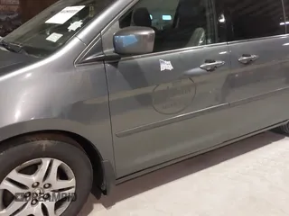 2010 Honda Odyssey EX-L with VIN 5FNRL3H78AB030111, listed as a IAAI auction lot 41250121 with 333,030 mi miles and . Bid and sale history available at DreamBid. Image 15.