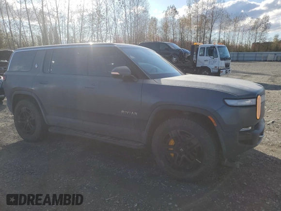 2022 Rivian R1S Launch Edition with VIN 7PDSGABL1NN000514, listed as a Copart auction lot 77444184 with 29,490 mi miles and Salvage Title. Bid and sale history available at DreamBid. Image 4.