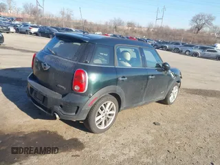 2012 MINI Countryman S with VIN WMWZC5C52CWL62574, listed as a IAAI auction lot 41768196 with 159,816 mi miles and . Bid and sale history available at DreamBid. Image 4.