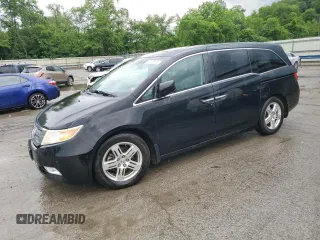 2012 Honda Odyssey Touring with VIN 5FNRL5H93CB080155, listed as a Copart auction lot 60149625 with 218,475 mi miles and Salvage title. Bid and sale history available at DreamBid. Image 1.