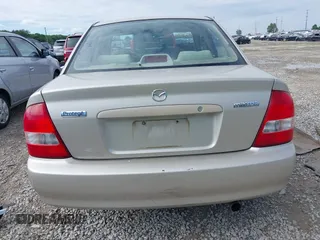 2001 Mazda Protege LX z VIN JM1BJ226210439446, wystawiony jako IAAI lot #42336976 z przebiegiem 155 990 mil mil oraz . Historia ofert i sprzedaży dostępna na DreamBid. Obrazek 17.