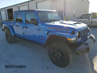 2023 Jeep Gladiator Mojave with VIN 1C6JJTEG7PL580727, listed as a Copart auction lot 48030215 with 12,707 mi miles and Salvage title. Bid and sale history available at DreamBid. Image 4.