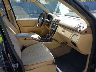 2003 Mercedes-Benz M-Class 3.7L with VIN 4JGAB57E03A418713, listed as a IAAI auction lot 41835875 with 195,982 mi miles. Bid and sale history available at carsss.com. Image 5.