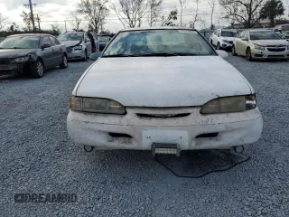 1994 Ford Thunderbird LX with VIN 1FALP62W6RH206764, listed as a Copart auction lot 44213965 with 105,353 mi miles and Salvage Title. Bid and sale history available at DreamBid. Image 5.