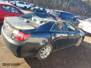2012 Toyota Camry Hybrid XLE with VIN 4T1BD1FK5CU061039, listed as a IAAI auction lot 41357985 with 76,493 mi miles. Bid and sale history available at carsss.com. Image 12.