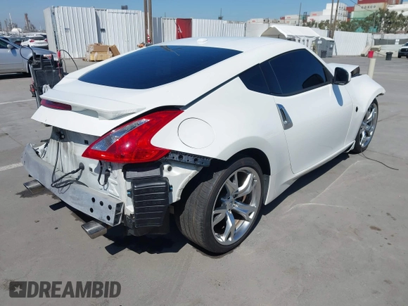 2009 Nissan 370Z Touring with VIN JN1AZ44E99M411252, listed as a IAAI auction lot 41969671 with 91,873 mi miles and . Bid and sale history available at DreamBid. Image 4.