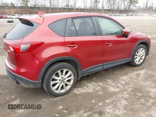 2013 Mazda CX-5 Grand Touring with VIN JM3KE4DE8D0164374, listed as a IAAI auction lot 41820866 with 145,815 mi miles. Bid and sale history available at carsss.com. Image 4.