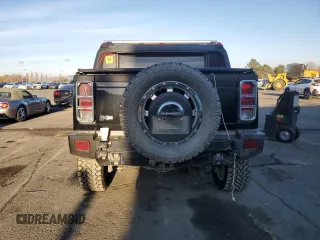 2005 Hummer H2 SUT with VIN 5GRGN22U15H101289, listed as a Copart auction lot 84107974 with 0 mi miles and Salvage Title. Bid and sale history available at carsss.com. Image 6.