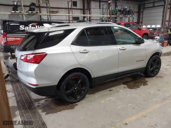2021 Chevrolet Equinox Premier with VIN 2GNAXNEV5M6119300, listed as a IAAI auction lot 41464166 with 76,462 mi miles. Bid and sale history available at carsss.com. Image 4.