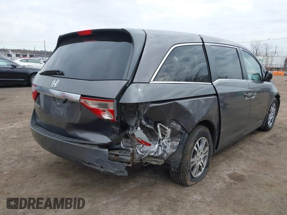 2012 Honda Odyssey EX-L with VIN 5FNRL5H65CB042898, listed as a IAAI auction lot 41784075 with 179,596 mi miles and . Bid and sale history available at carsss.com. Image 6.