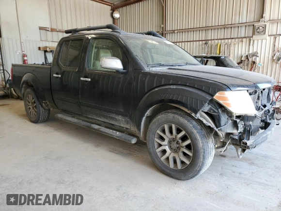 2009 Nissan Frontier LE with VIN 1N6AD09U79C409698, listed as a Copart auction lot 55843545 with 230,334 mi miles and Salvage title. Bid and sale history available at DreamBid. Image 4.
