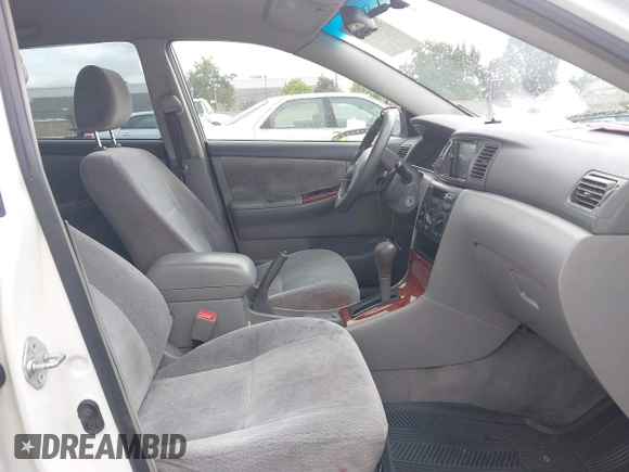 2004 Toyota Corolla CE with VIN JTDBR32E440052035, listed as a IAAI auction lot 42218301 with 299,999 mi miles. Bid and sale history available at carsss.com. Image 5.