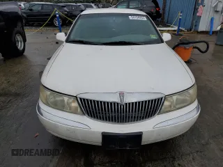 1999 Lincoln Continental with VIN 1LNHM97V3XY667567, listed as a Copart auction lot 84194854 with 137,163 mi miles and Salvage Title. Bid and sale history available at carsss.com. Image 5.