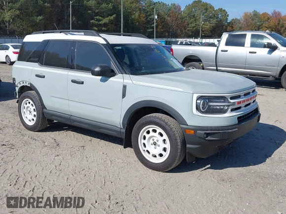 2023 Ford Bronco Sport Heritage z VIN 3FMCR9G61PRD08589, wystawiony jako IAAI lot #40706185 z przebiegiem 150 000 mil mil oraz . Historia ofert i sprzedaży dostępna na DreamBid. Obrazek 1.