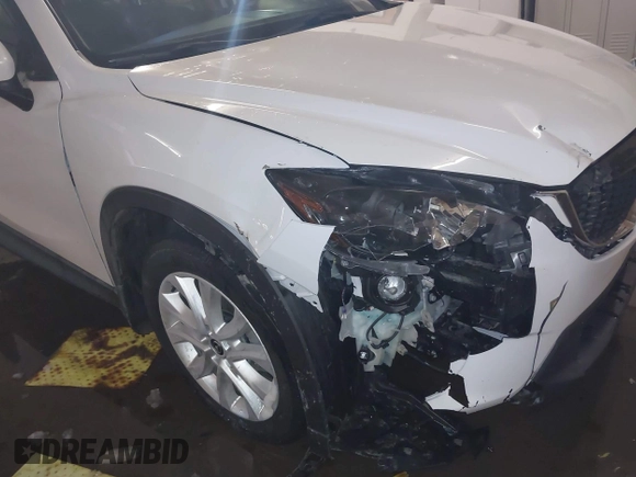 2013 Mazda CX-5 Grand Touring with VIN JM3KE4DE8D0147851, listed as a IAAI auction lot 41570695 with 94,648 mi miles. Bid and sale history available at carsss.com. Image 6.
