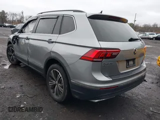 2021 Volkswagen Tiguan SE with VIN 3VV2B7AX8MM100651, listed as a IAAI auction lot 41803931 with 69,405 mi miles and . Bid and sale history available at DreamBid. Image 3.