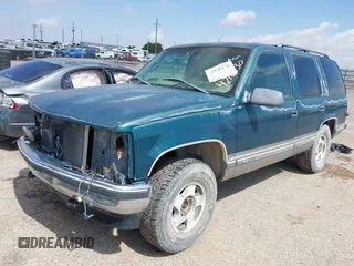 1998 GMC Yukon z VIN 1GKEK13R3WJ715863, wystawiony jako IAAI lot #42410130 z przebiegiem 154 139 mil mil oraz . Historia ofert i sprzedaży dostępna na DreamBid. Obrazek 2.