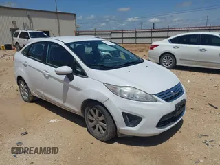2012 Ford Fiesta SE with VIN 3FADP4BJ8CM161701, listed as a IAAI auction lot 42140579 with 59,496 mi miles. Bid and sale history available at carsss.com. Image 1.